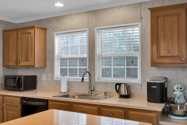 kitchen featuring brown cabinetry, ornamental molding, a sink, black appliances, and light countertops