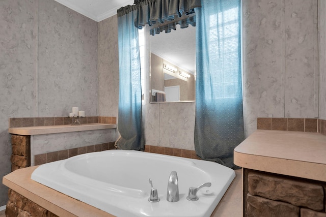 bathroom featuring wallpapered walls, a garden tub, and ornamental molding