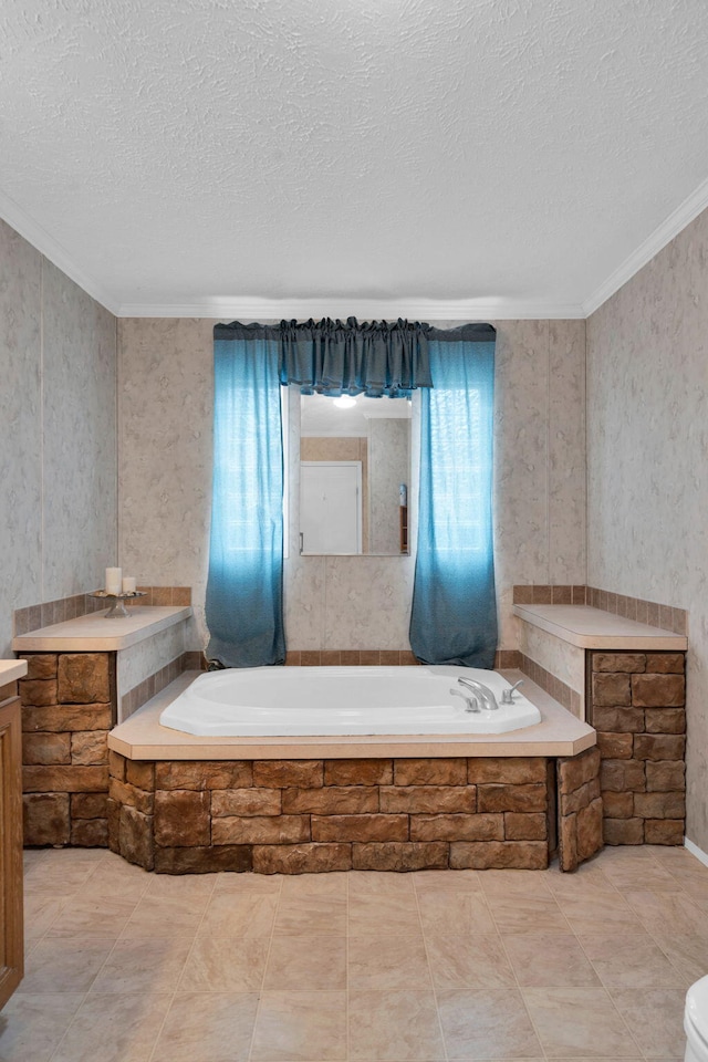 full bath with vanity, crown molding, a bath, and a textured ceiling