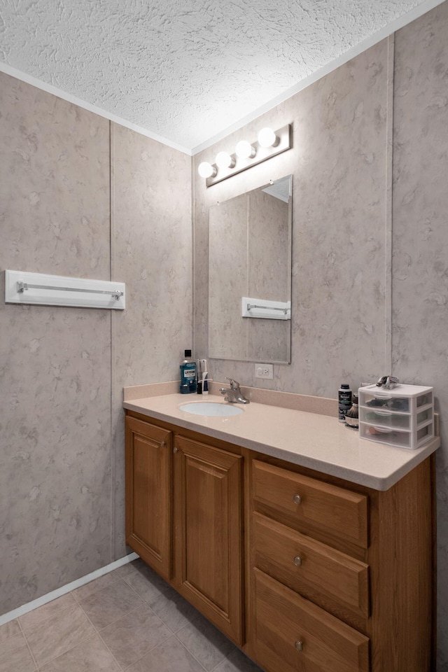 bathroom featuring a textured ceiling, vanity, and tile patterned flooring