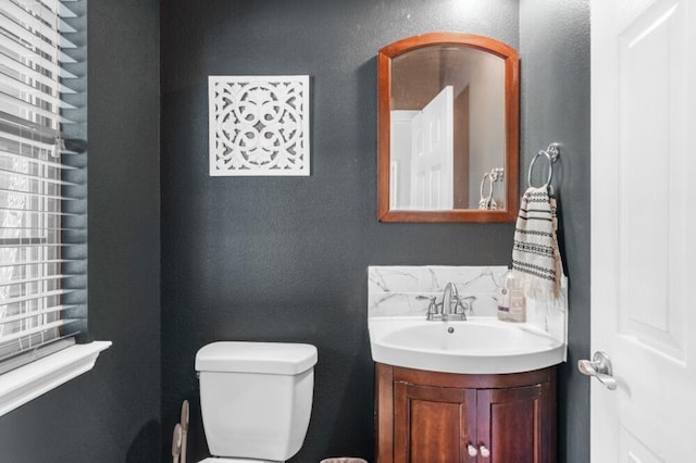 half bath with toilet and vanity