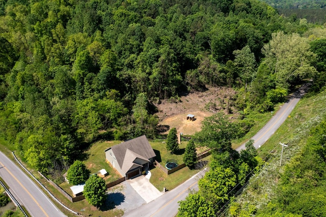 bird's eye view featuring a forest view