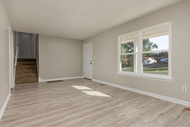 empty room with light wood-type flooring