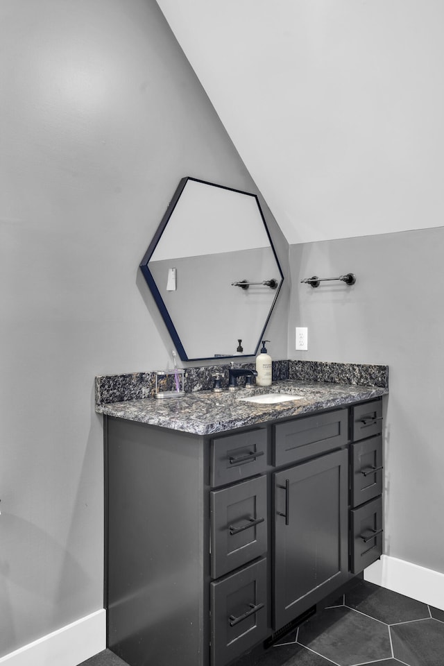 bathroom with tile patterned flooring and vanity