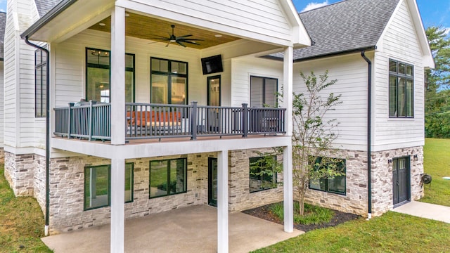 back of house with a balcony, ceiling fan, and a patio area