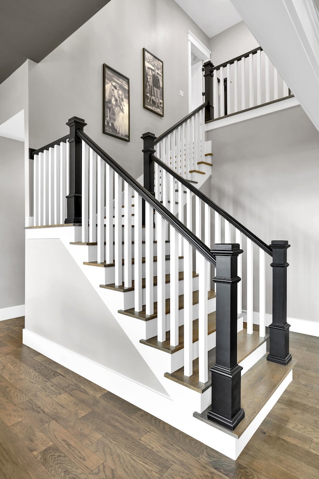 stairway featuring hardwood / wood-style floors