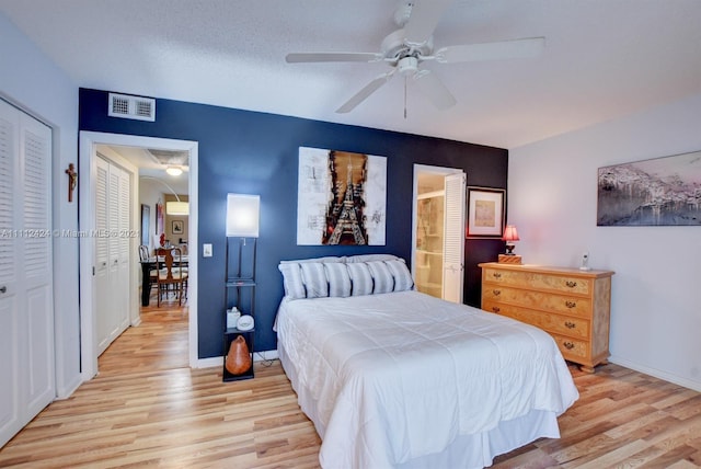 bedroom featuring a closet, ceiling fan, and light wood-type flooring