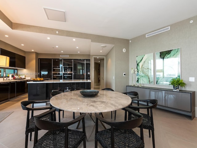 tiled dining room with sink