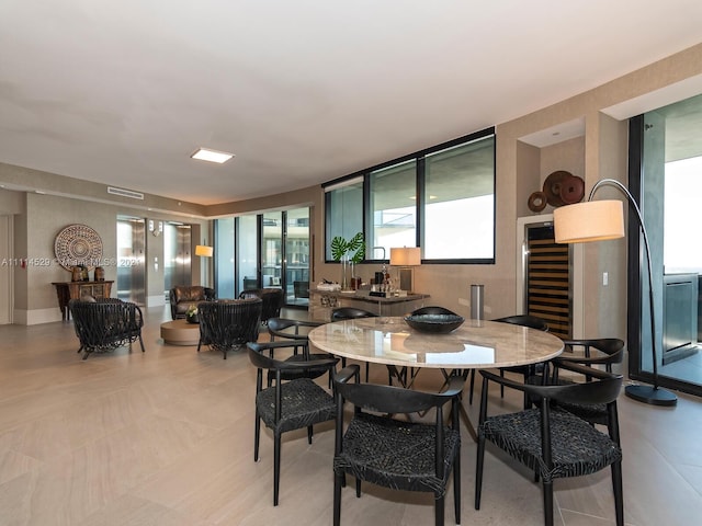 dining room featuring light tile floors and a wealth of natural light