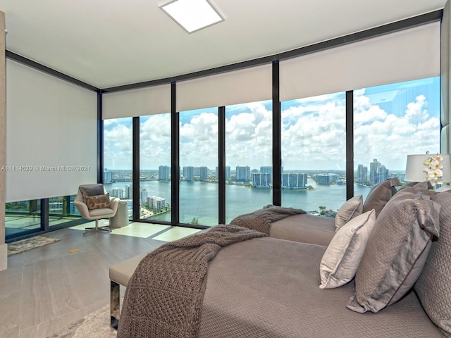 bedroom featuring expansive windows and multiple windows