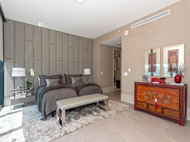 bedroom with light tile flooring