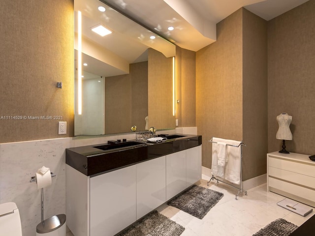 bathroom with vanity, tile floors, and toilet