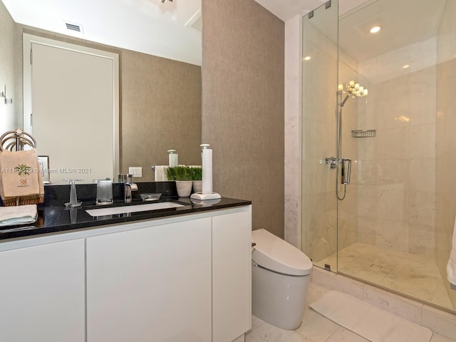 bathroom featuring a chandelier, toilet, dual vanity, walk in shower, and tile flooring