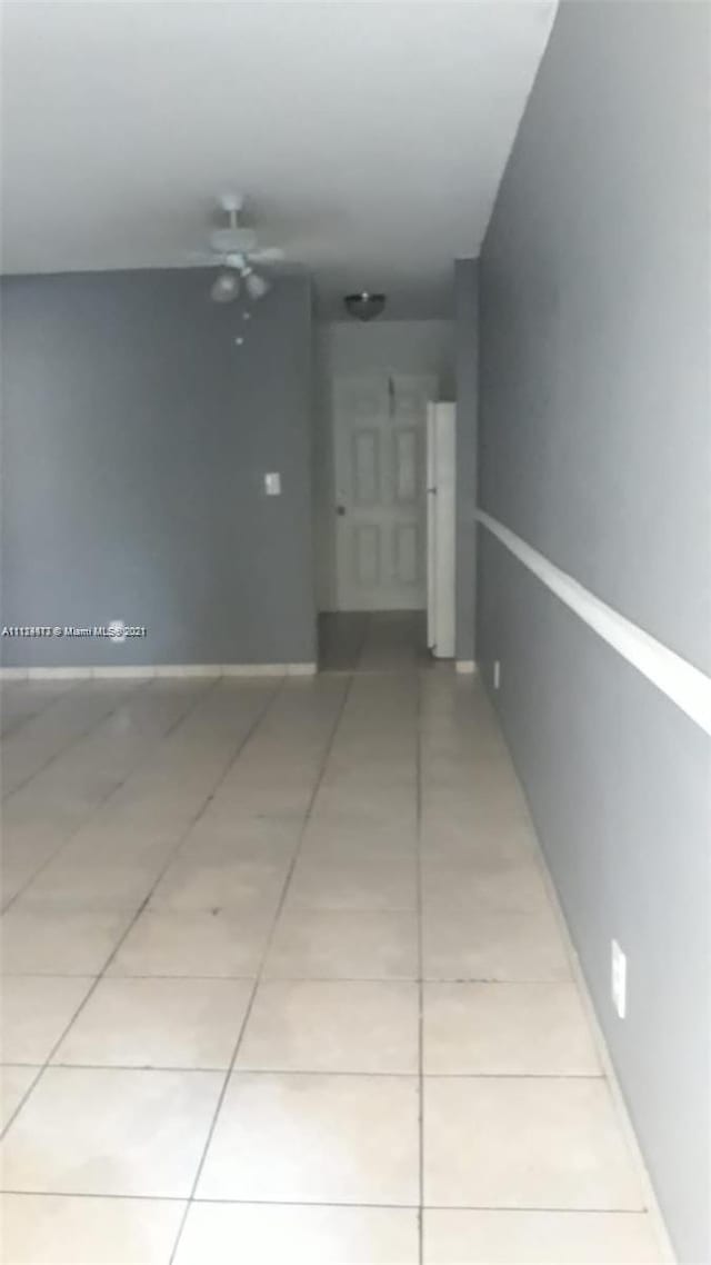 hallway with light tile patterned floors