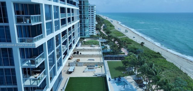 bird's eye view featuring a view of the beach and a water view