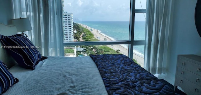 bedroom featuring a water view