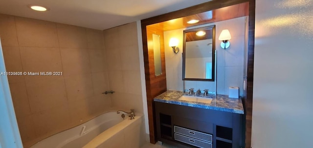 bathroom with vanity and a bathtub