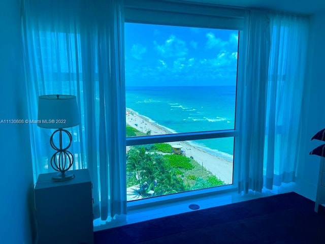 interior details with a water view and a view of the beach