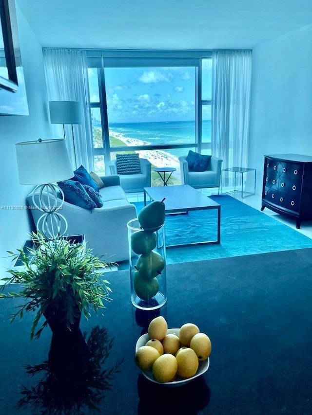 living room featuring expansive windows and a water view