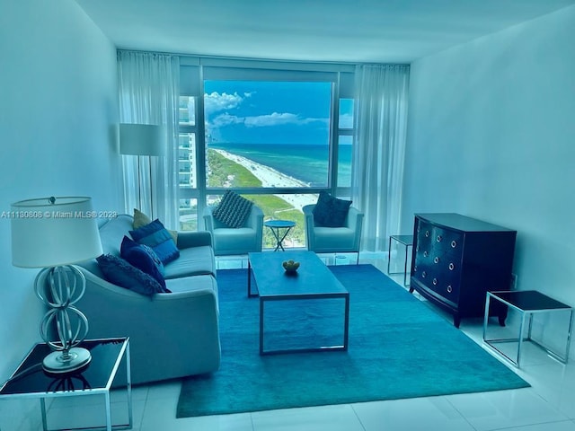 living room with a water view and tile floors