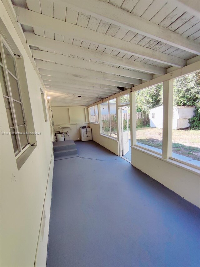 interior space featuring beamed ceiling