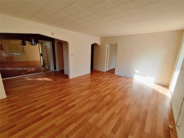 unfurnished room with light wood-type flooring