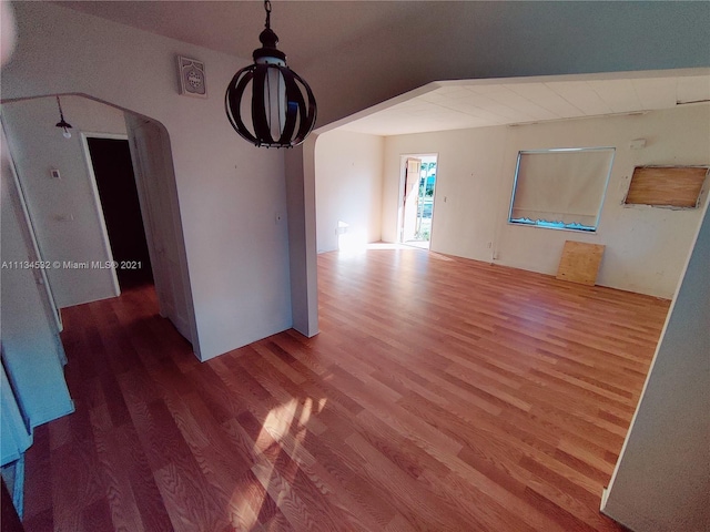 unfurnished room featuring dark wood-type flooring