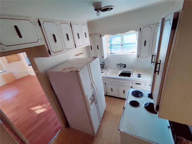 laundry room with light colored carpet