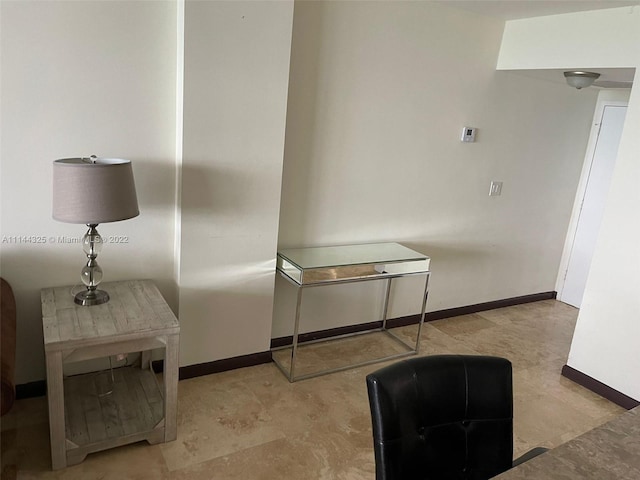 sitting room featuring light tile floors