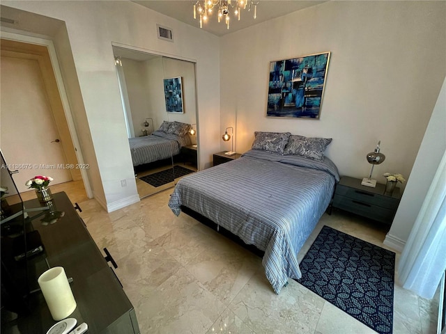 tiled bedroom with a closet, a chandelier, and a baseboard radiator