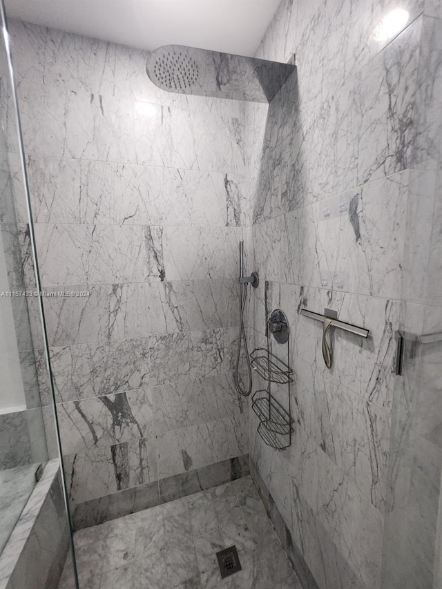 bathroom with tiled shower