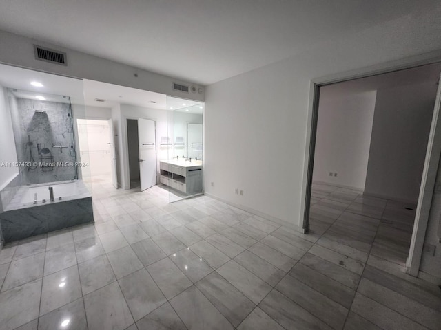 unfurnished living room with light tile floors