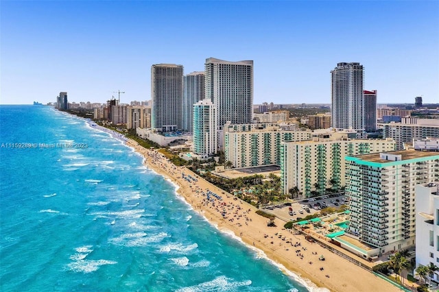 bird's eye view featuring a beach view and a water view