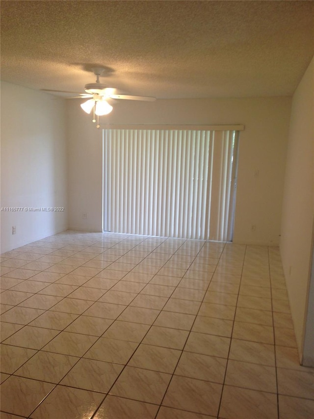 4142 NW 90th Ave Unit 202, Coral Springs, FL 33065 - empty room featuring ceiling fan, light tile patterned floors, and a textured ceiling