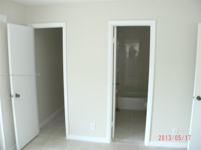 unfurnished bedroom with light tile patterned floors