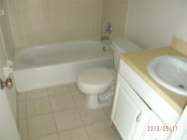 bathroom featuring tile patterned flooring, vanity, and toilet