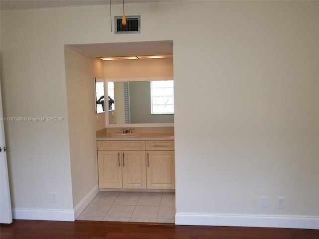 bathroom featuring vanity and hardwood / wood-style flooring