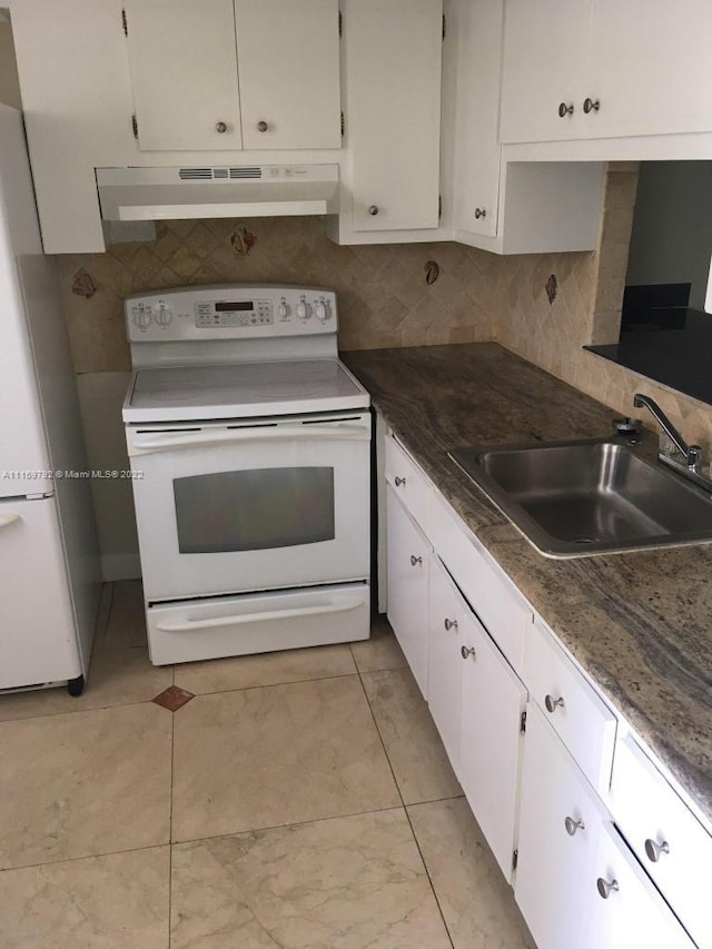 kitchen with sink, light tile patterned floors, white appliances, decorative backsplash, and white cabinets