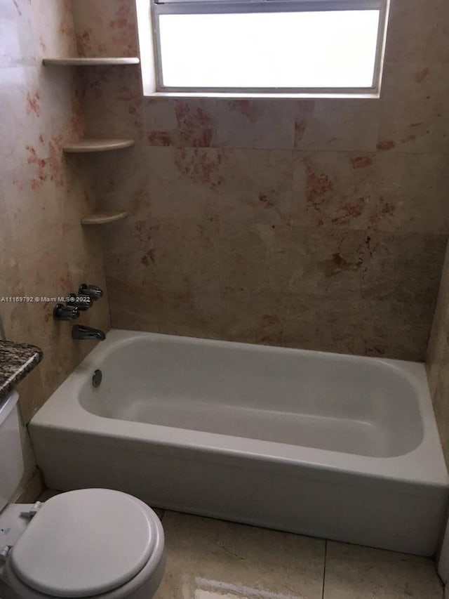 full bathroom featuring tile patterned floors, plenty of natural light, toilet, and vanity