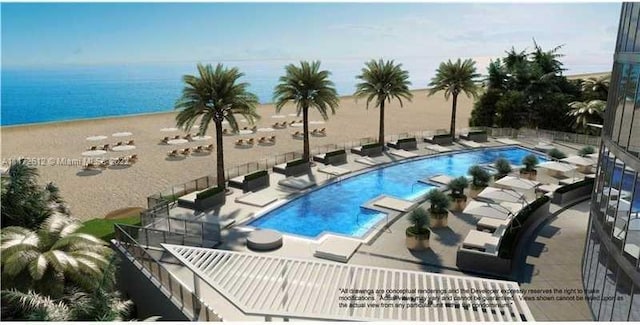 view of pool with a patio and a water view