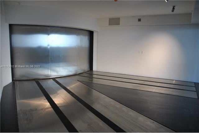 unfurnished room featuring dark hardwood / wood-style floors