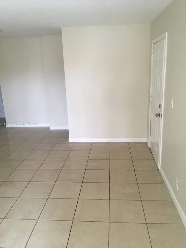 view of tiled spare room