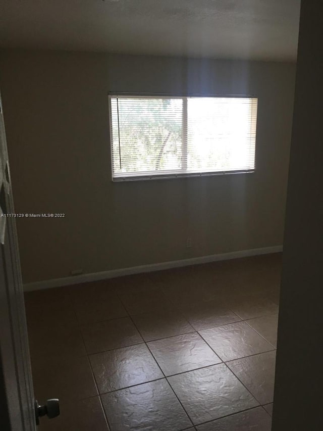 view of tiled spare room