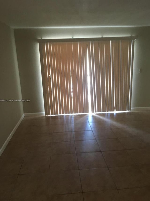 view of tiled spare room