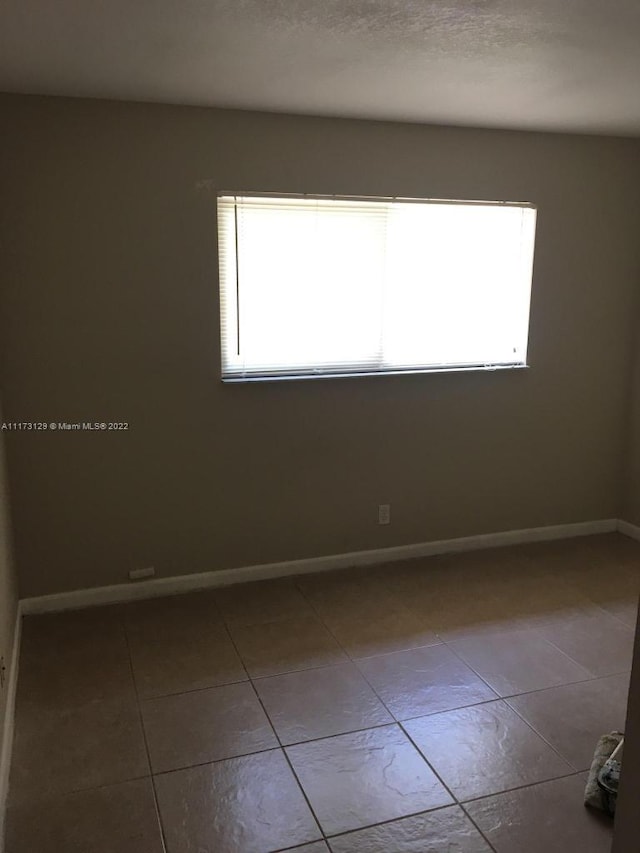 view of tiled spare room