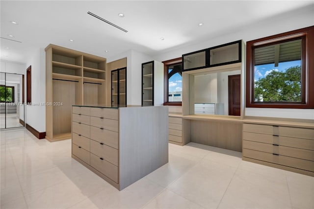 walk in closet featuring light tile patterned floors