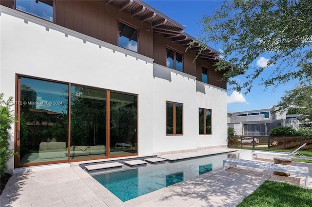 view of pool featuring a patio