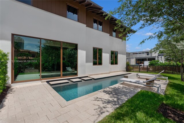 view of swimming pool with a patio area