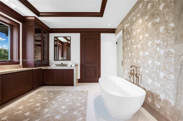 bathroom featuring vanity, a tub to relax in, tile patterned flooring, and ornamental molding