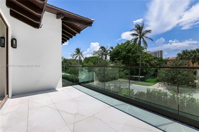 view of patio featuring a balcony